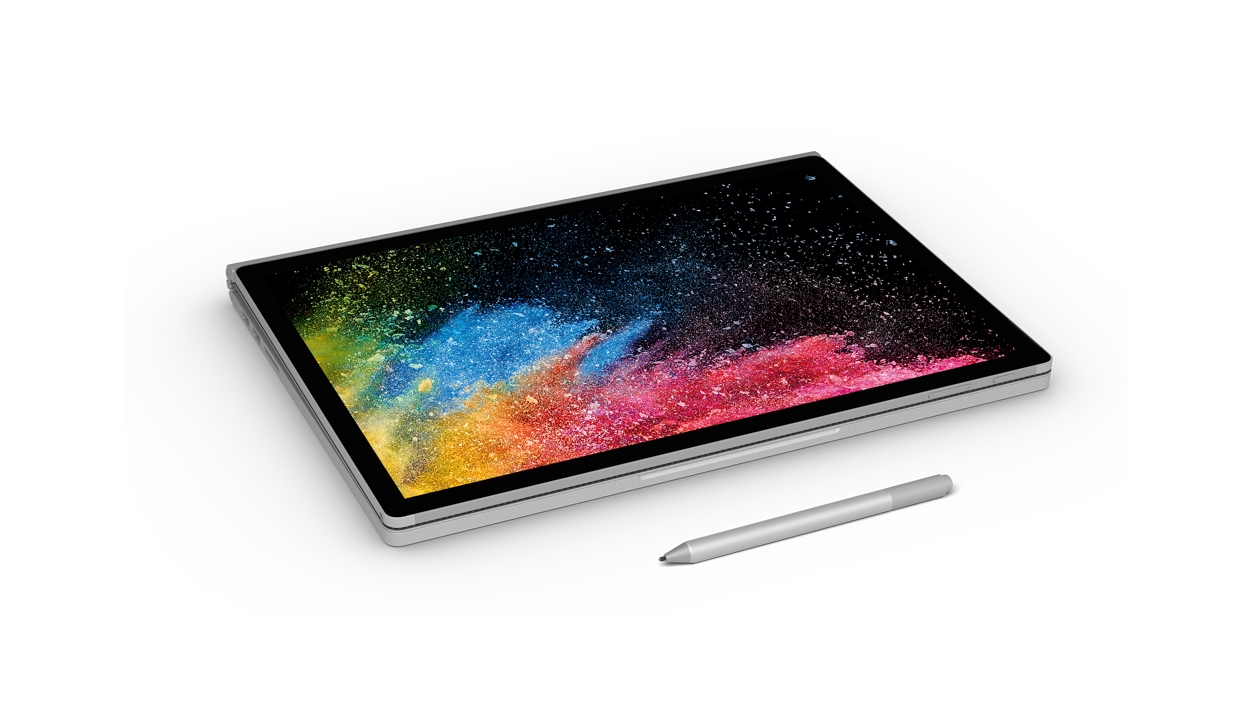 Surface Book 2 flach im Tablet-Modus mit Surface Pen: Schrägansicht.