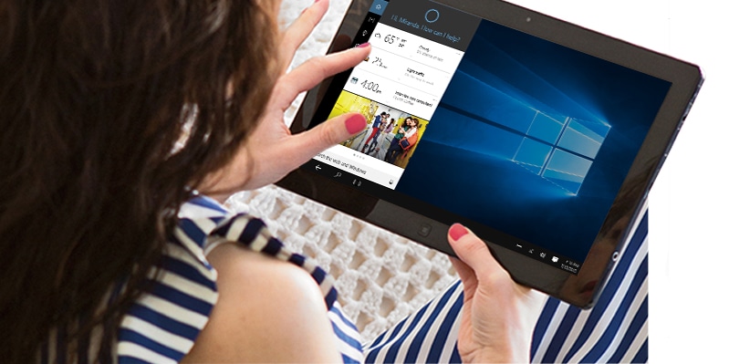 Una mujer usando una tableta con Cortana.