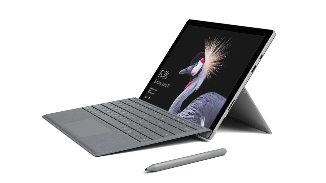 Surface Pro left facing side view with gray type cover and pen