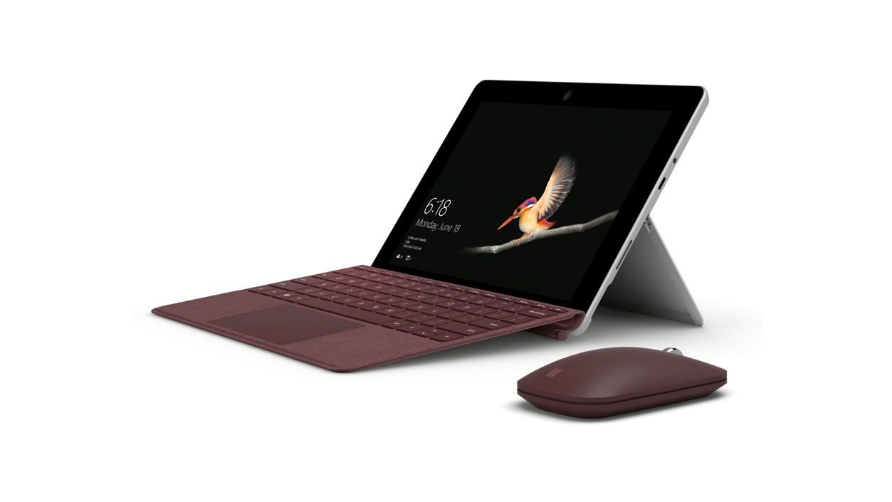 Surface Go with burgundy type cover and mouse
