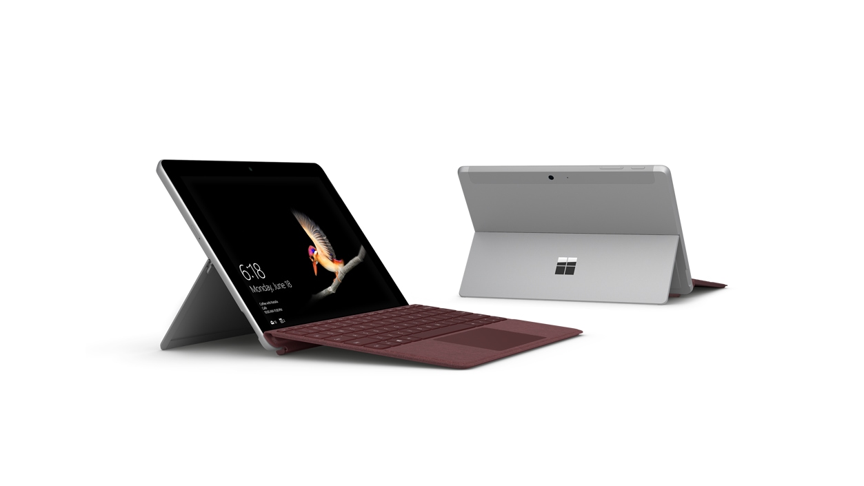 Two Surface Go devices with kickstand down on a flat surface