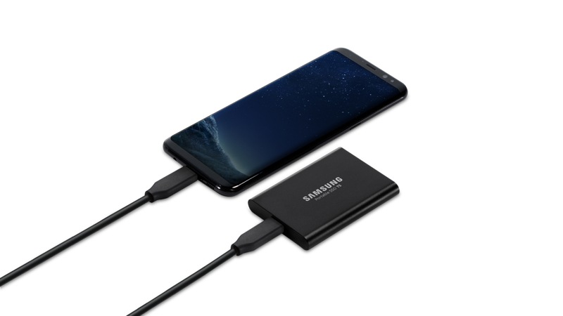Samsung T5 Portable 2TB External SSD connected to a phone