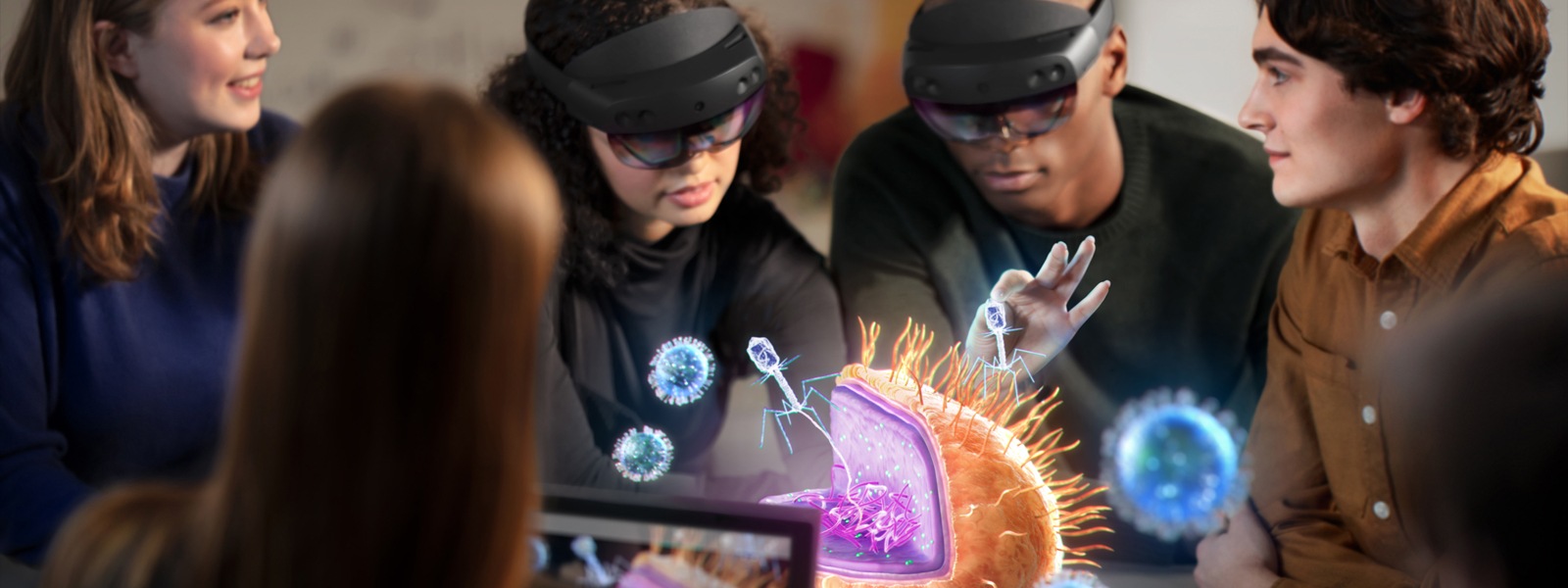 Three coworkers use HoloLens devices to observe the human brain.