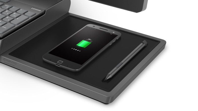 close up of the Lenovo Yoga A940 F0E50000US AIO wireless charging dock with phone and groove for pen storage.
