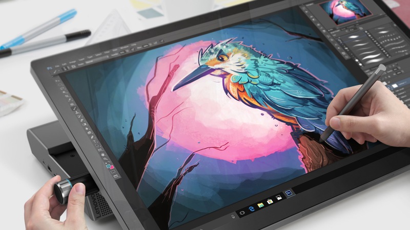 person drawing on the Lenovo Yoga A940 F0E50000US AIO and using the content creation dial