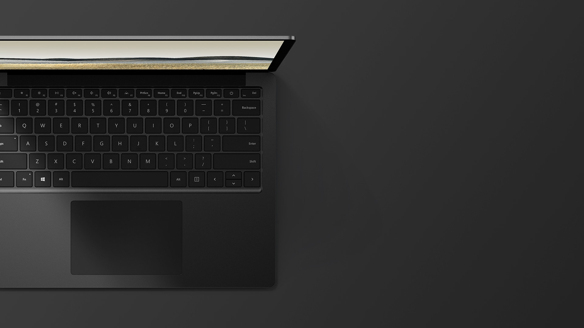 Widziany z góry komputer Surface Laptop 3 z ekranem o przekątnej 13,5” w kolorze matowej czerni