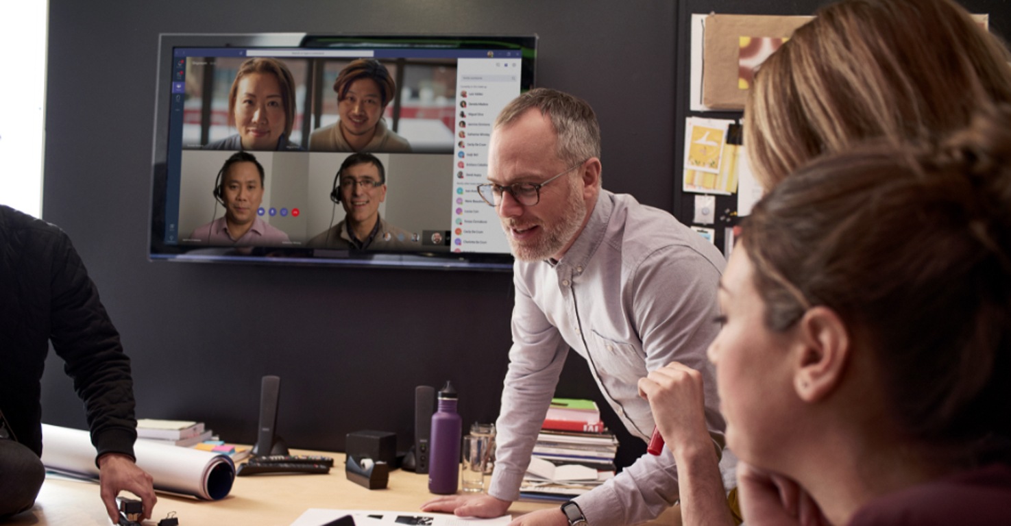 A meeting with people participating in person and online with Microsoft Teams