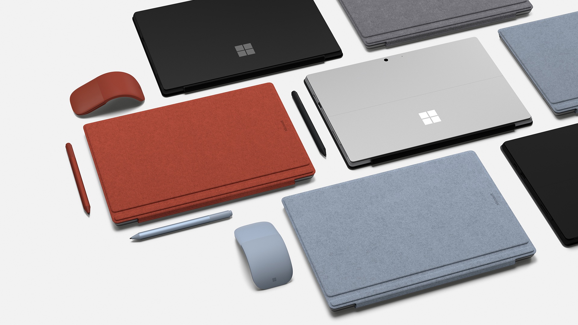 Grouping of Surface Type Covers, Surface Pens, and Surface Mice on tabletop