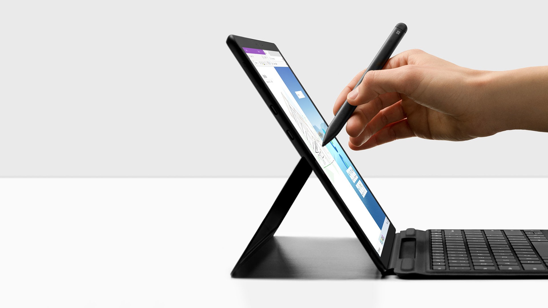 Surface Pro X with Surface Slim Pen being lifted off of Surface Pro X Signature keyboard 