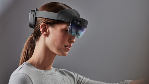 A woman wearing a Microsoft HoloLens glass
