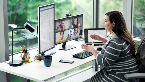 A woman having a video conference while working from home