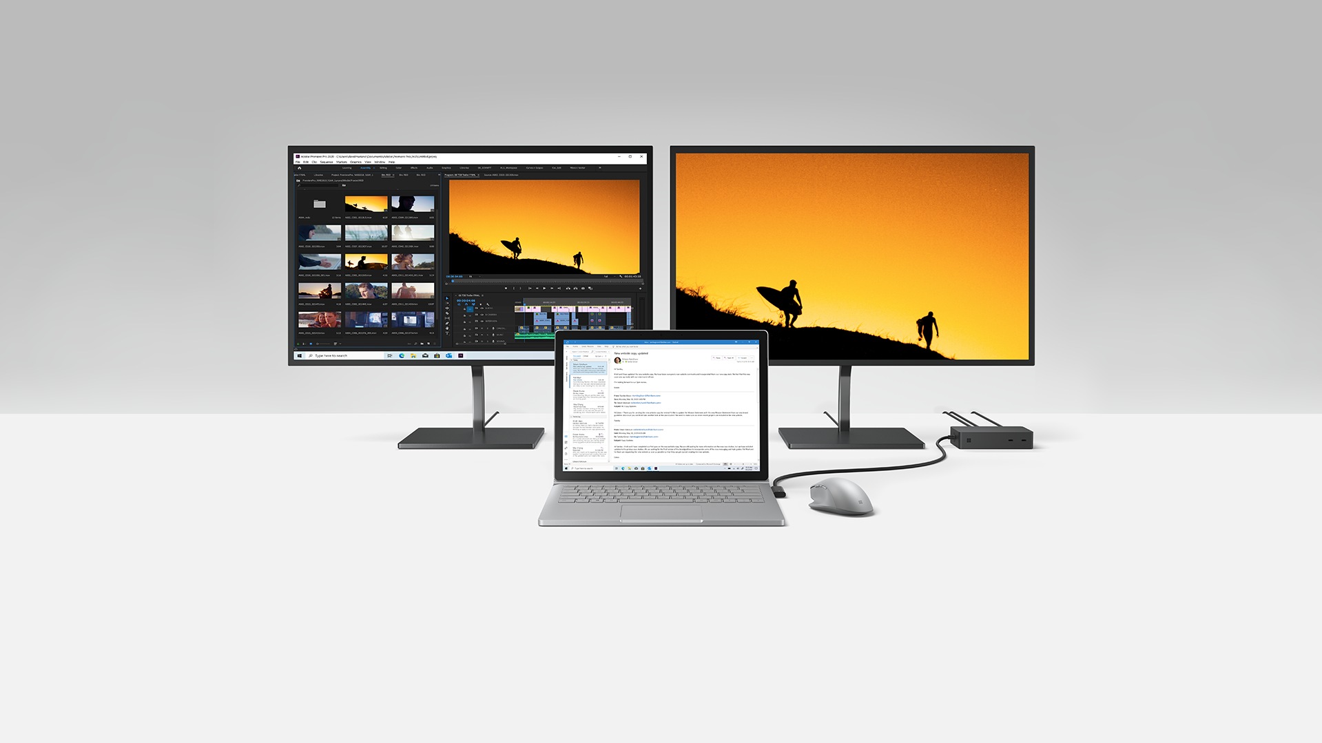 Multiple monitors and laptop connected to a Surface Dock