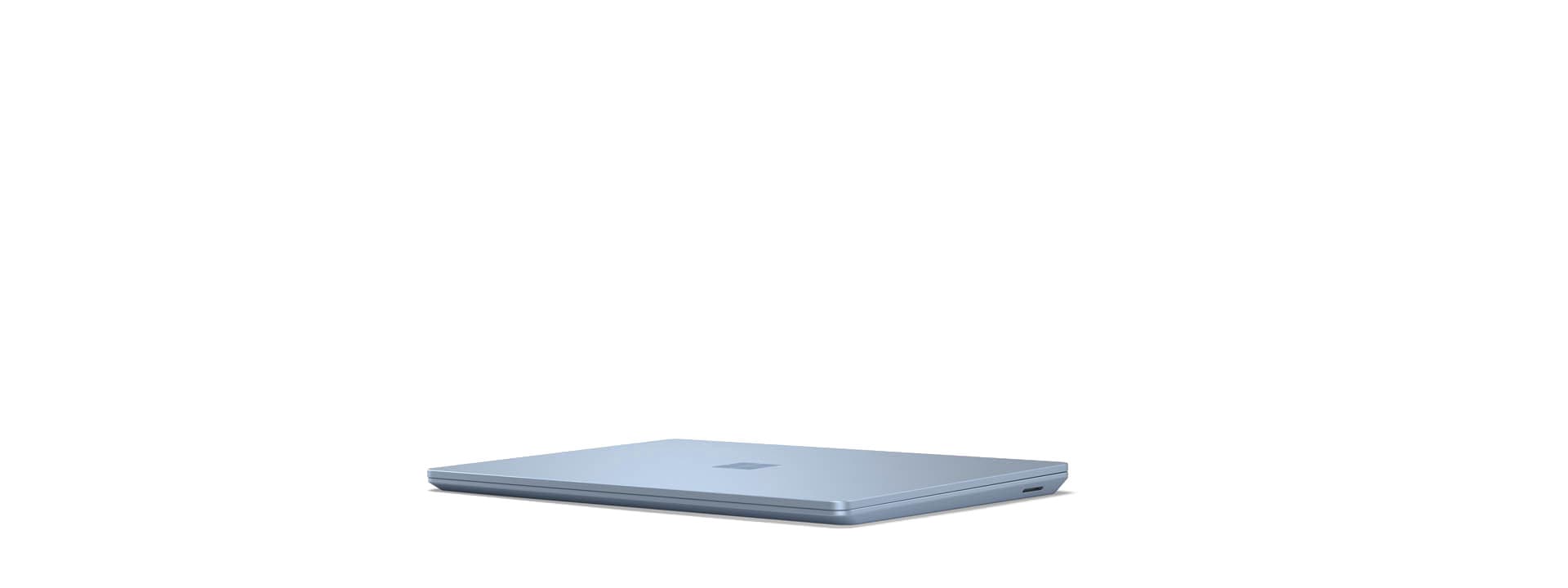 A Surface Laptop Go is shown in the closed position.