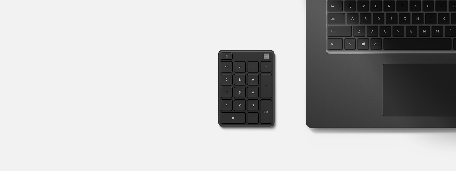 A Microsoft Number Pad in Matte Black color next to a keypad