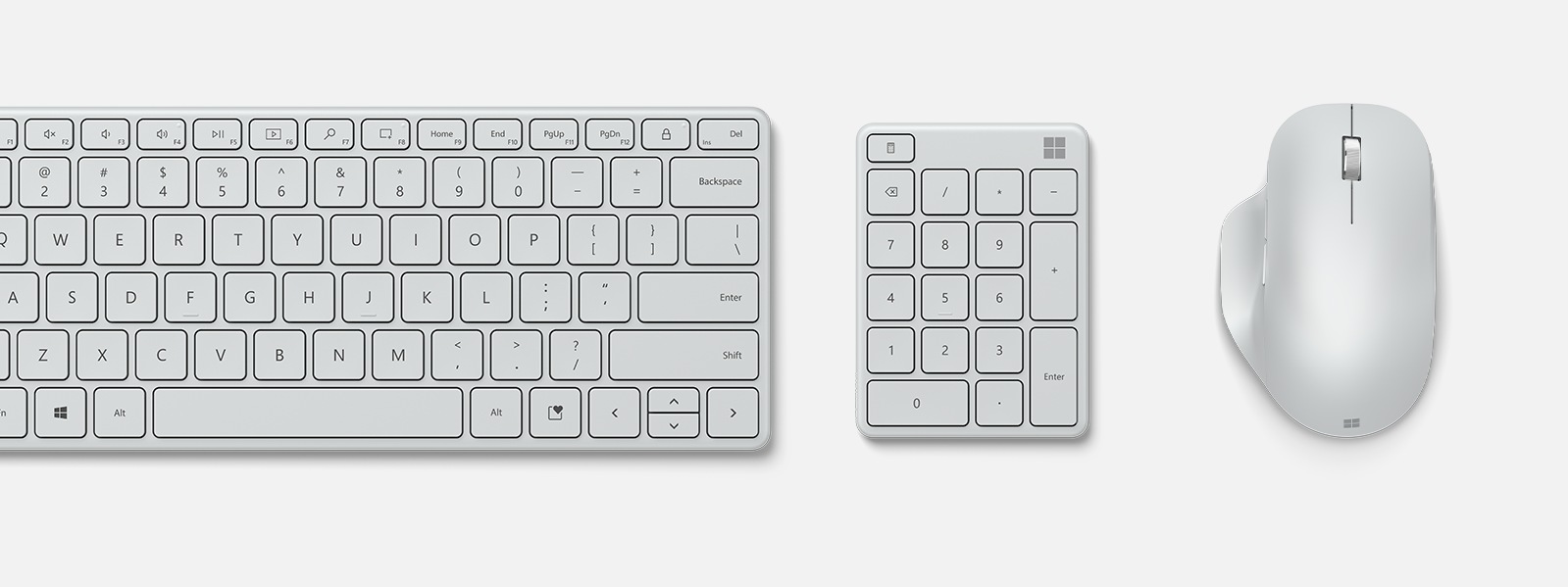 Microsoft Number Pad entre un mouse y un teclado compacto