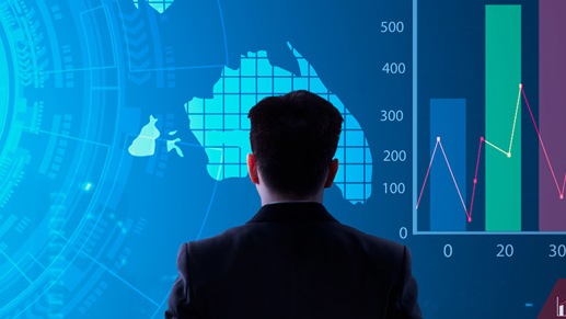 Man stands in front of large screen with map and infographic