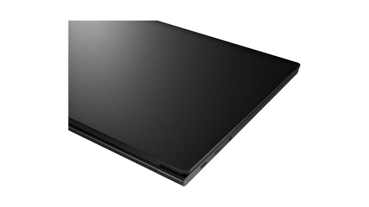 Angled top down view of IdeaPad Slim 9 closed with leather cover.