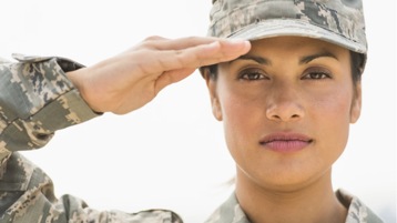 A member of the armed forces saluting in uniform.