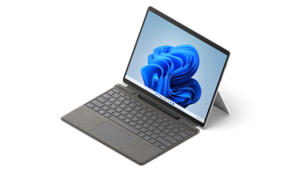 Surface Pro X shown with Pro Signature Keyboard and Slim Pen 2.