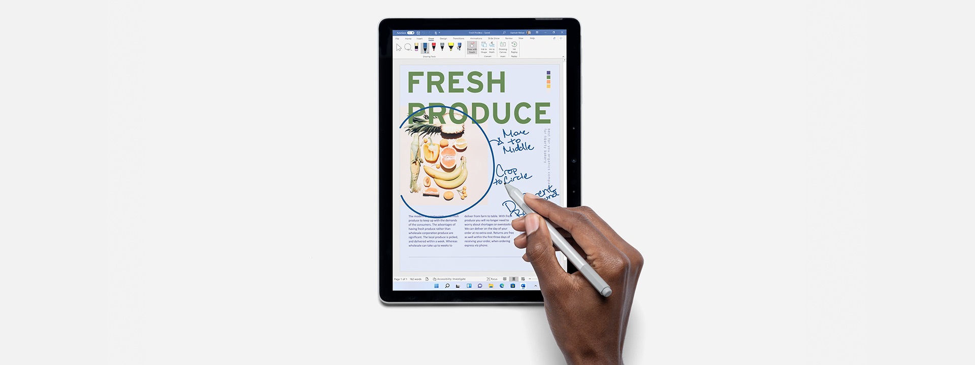 Person using Surface Pen and Surface Go 3 to work in Microsoft Word.