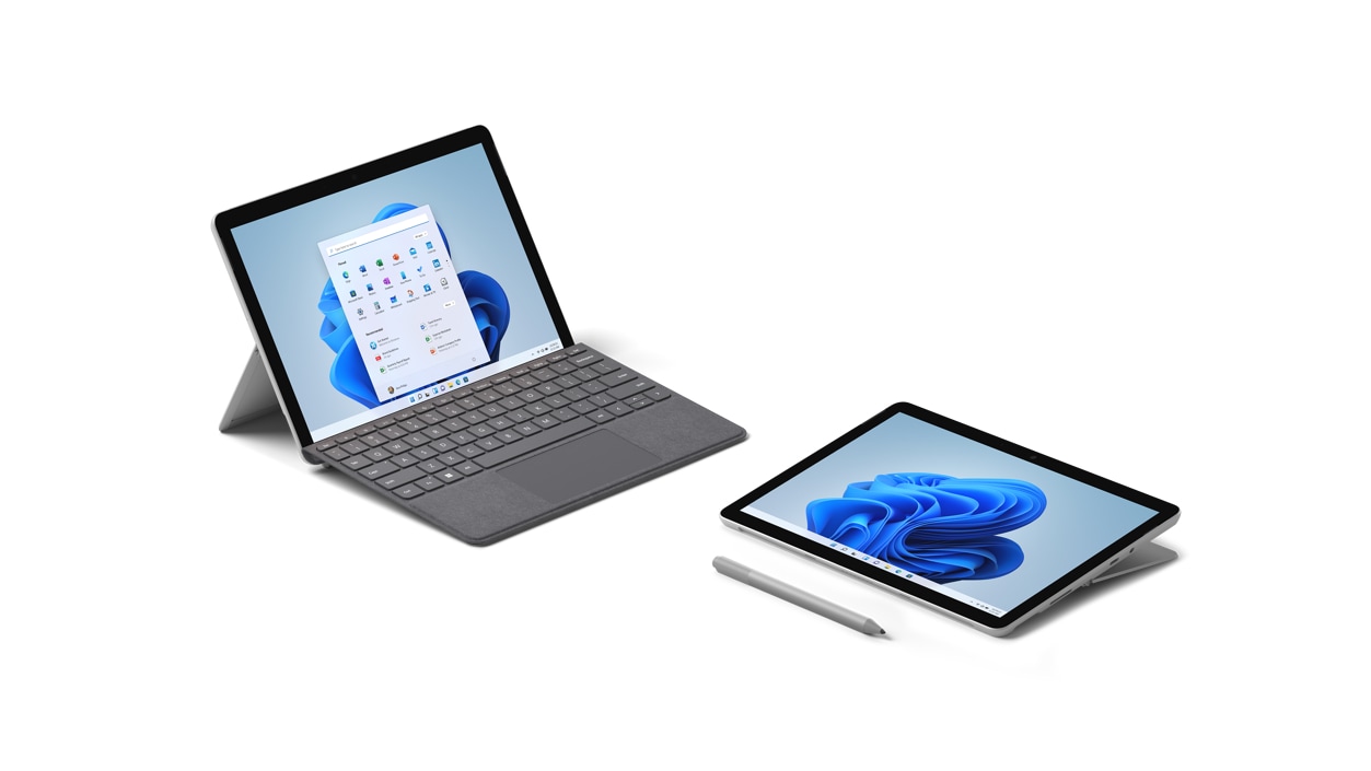 A Surface Go 3, shown in Laptop Mode with a Surface Type Cover and a Surface Go 3, shown in Studio Mode beside a digital pen.