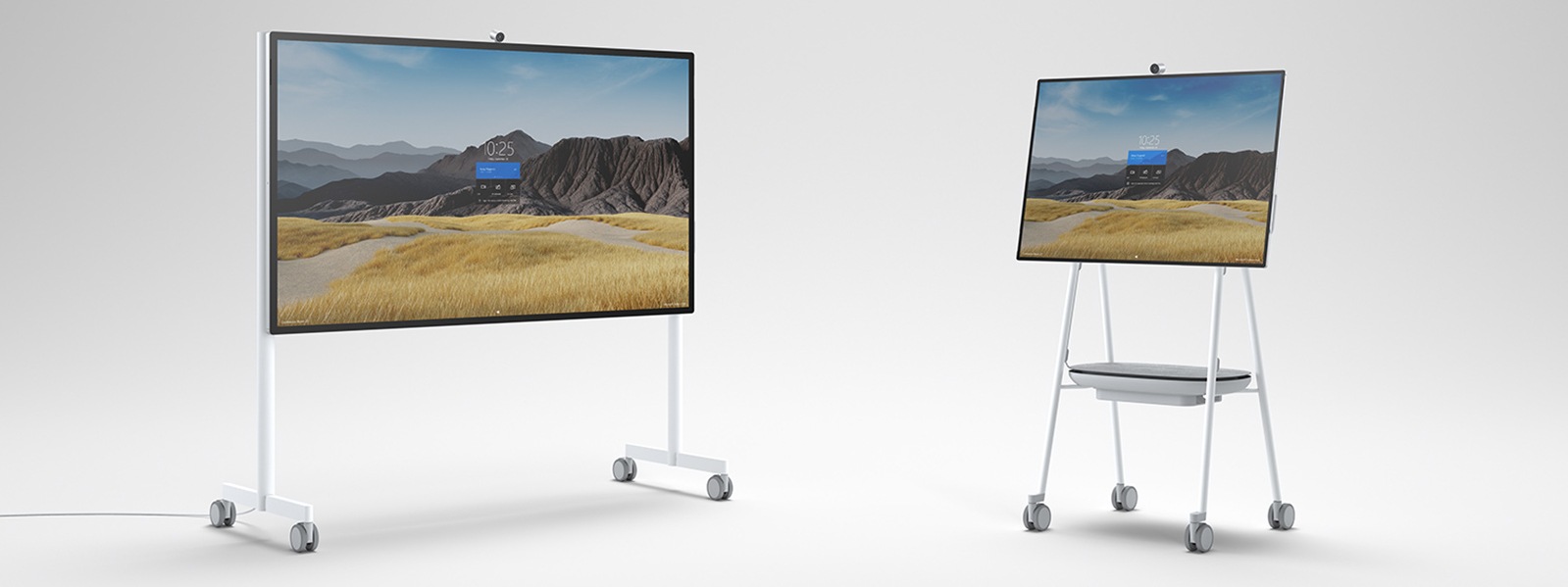 Surface Hub 2S in both 50-inch and 85-inch sizes are seen side-by-side on Steelcase Roam™ Mobile Stands