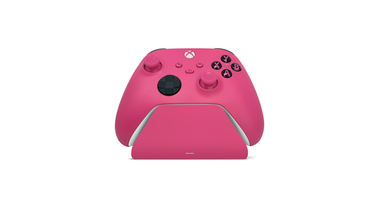 Front view of deep pink Xbox controller charging stand with matching controller docked.