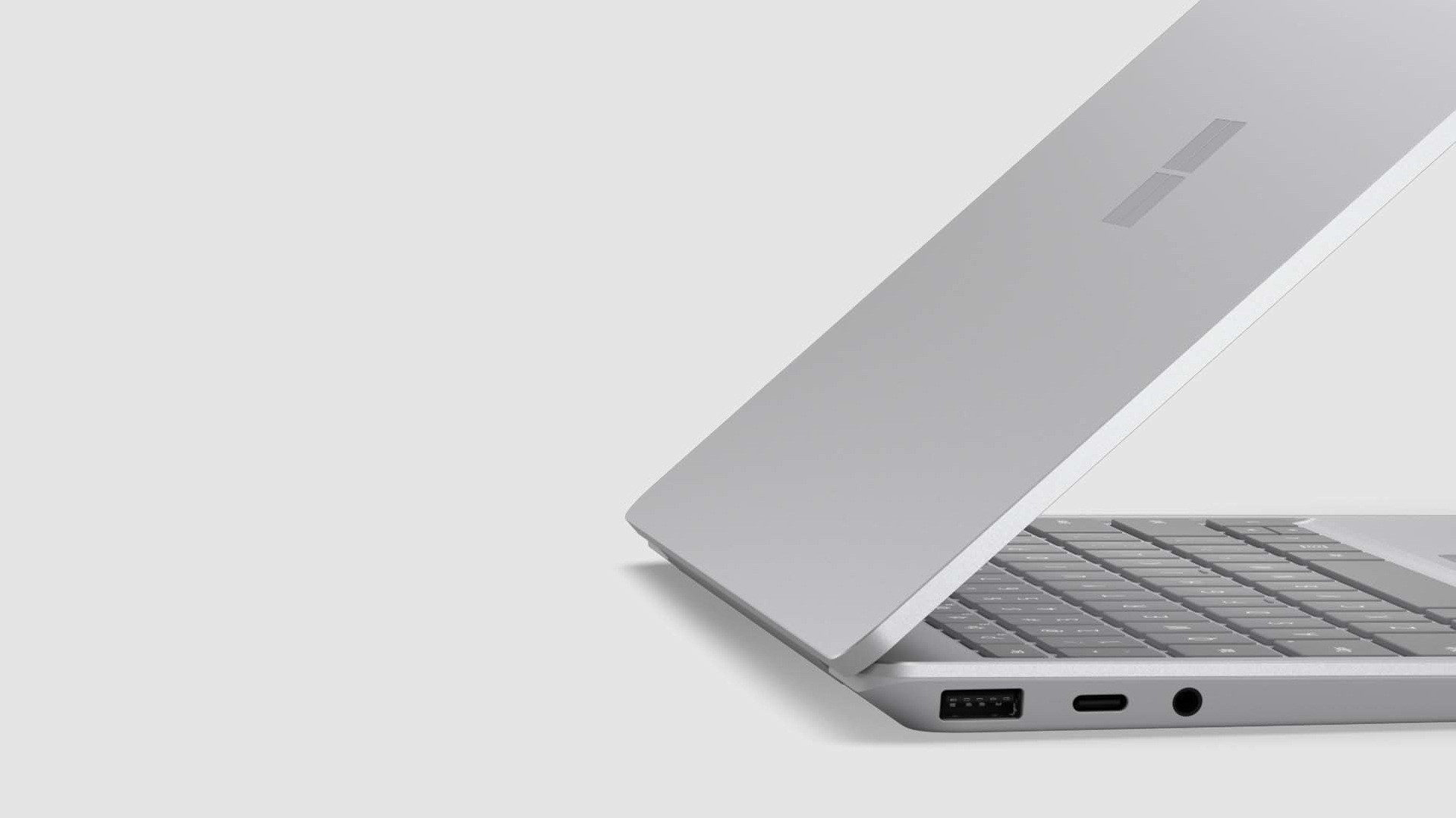 A side view of a Surface Laptop Go 2 three-quarters of the way open