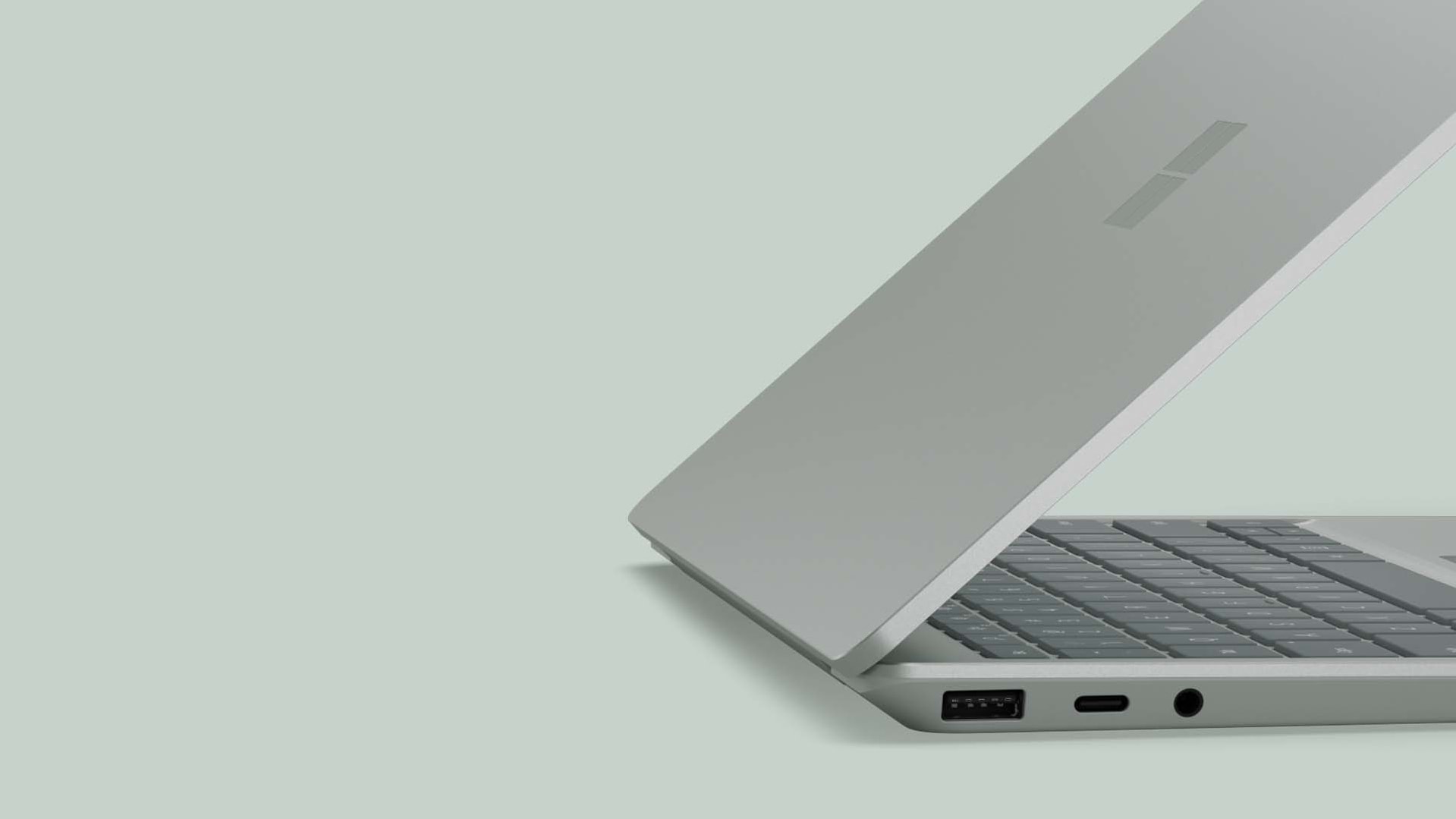 A side view of a Surface Laptop Go 2 three-quarters of the way open