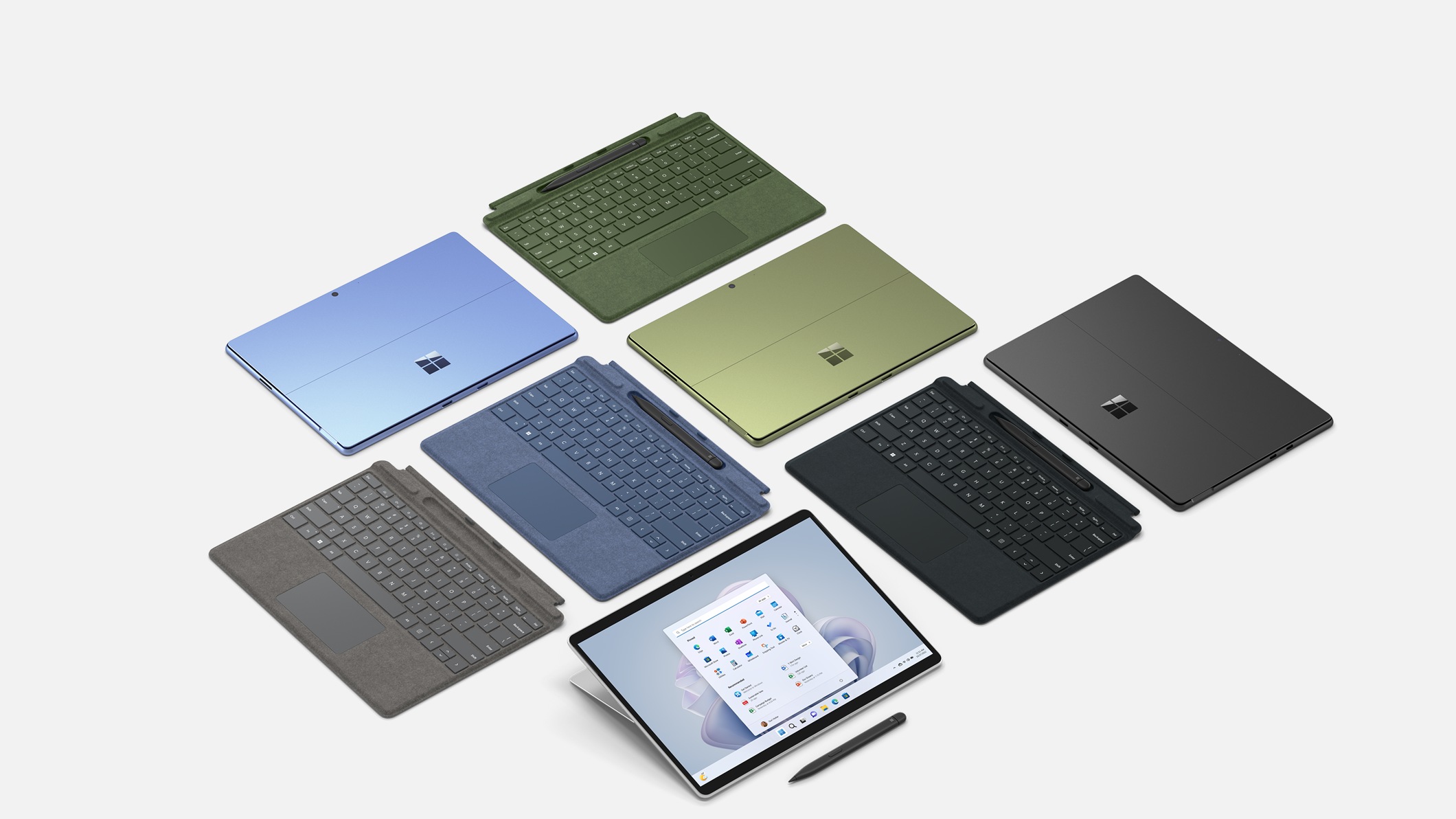 Surface Pro Signature Keyboard with Slim Pen 2 devices in a variety of colors.