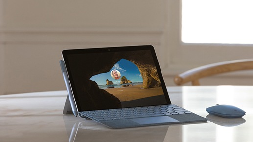 Surface Go 2 for Business and mouse on tabletop