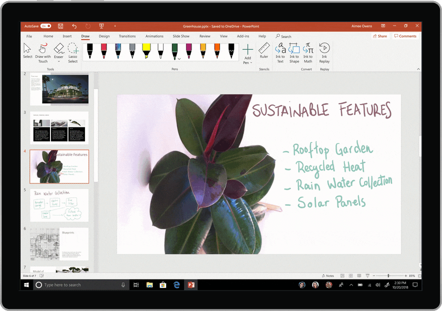 Photograph of a tablet device displaying a presentation being created in PowerPoint