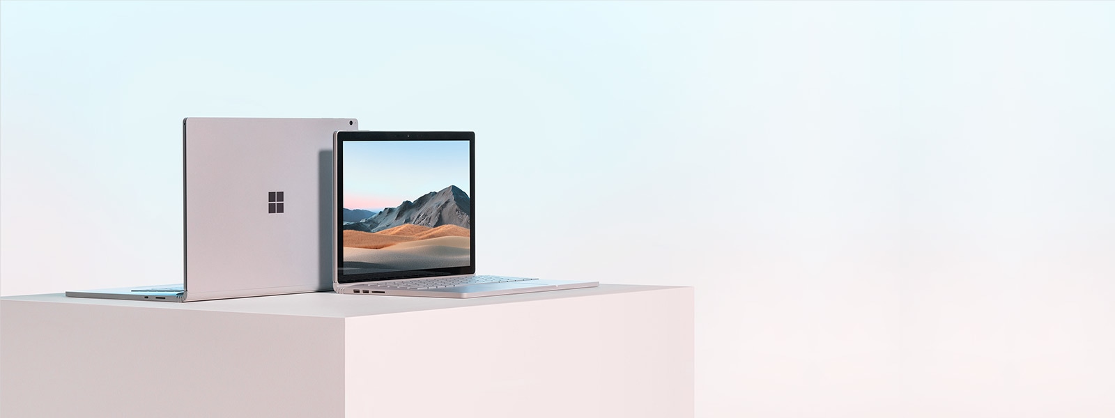 Surface Book 3 13.5” facing front and Surface Book 3 15” from behind