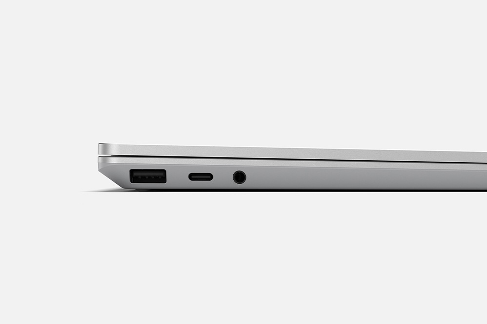The side profile of a surface Laptop Go featuring the headphone jack, charging location and USB input.