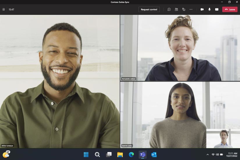 A group of people join a Microsoft Teams call on a Surface Pro 9
