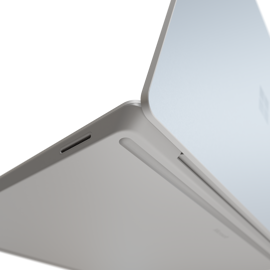 A closeup view of a foot on Surface Laptop Go 2 and 3.