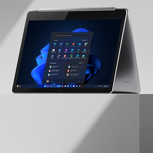 A 2-in-1 device displaying the Windows 11 start screen
