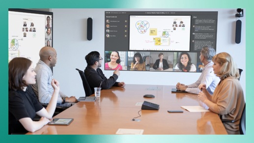 Five people in a conference room participating in a Teams video call being displayed on a wall.