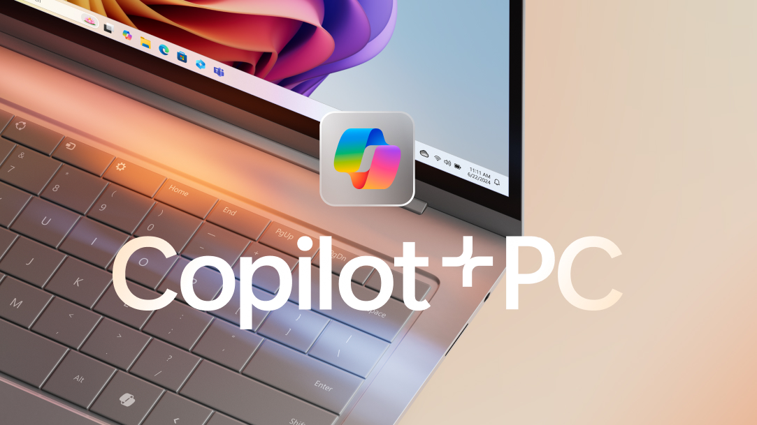 Portátil com o logótipo do Copilot e uma imagem a florescer colorida