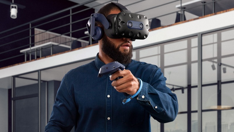 Man experiencing V R with a VIVE Pro 2 Headset.