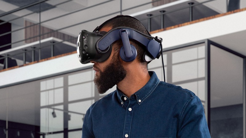 Man looking left experiencing V R with a VIVE Pro 2 Headset.