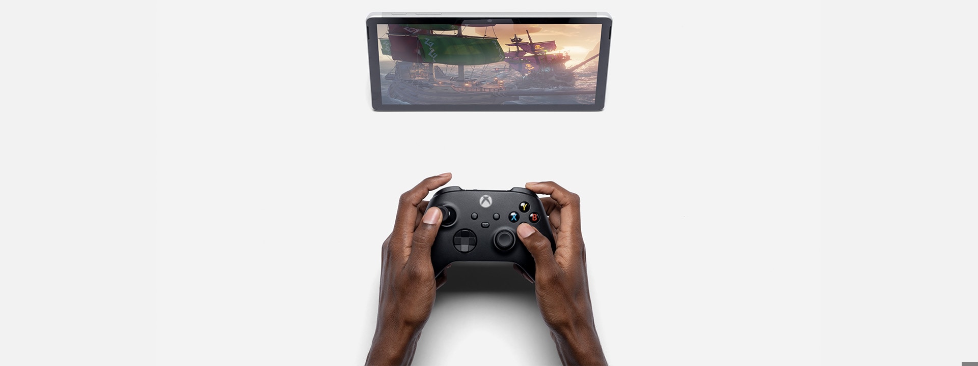 Surface Go 3 ที่แสดงในโหมดขาตั้ง Kickstand พร้อมคอนโทรลเลอร์ Xbox และแอป Xbox