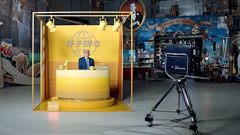 A news desk in a live broadcast studio.