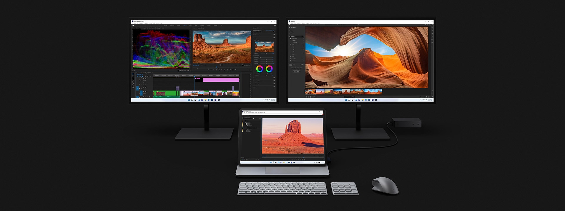 Surface Laptop Studio didok pada dua monitor yang lebih besar sedang digunakan untuk mengedit video.