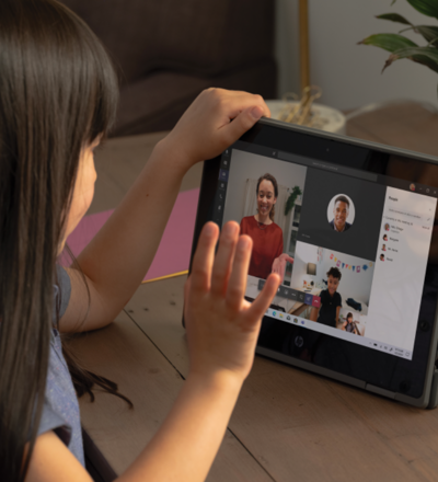 A child using their tablet for a Teams video call.