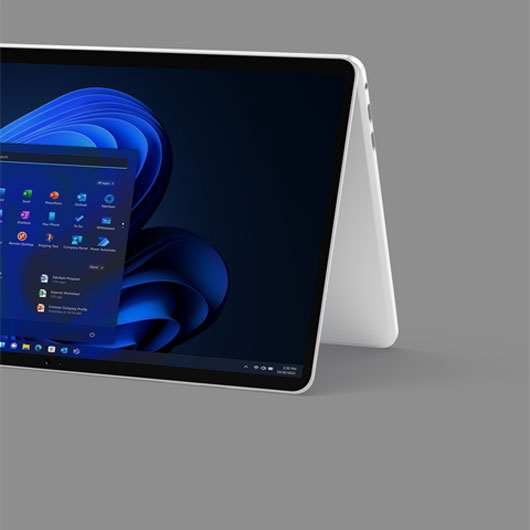 A 2-in-1 device displaying the Windows 11 start screen