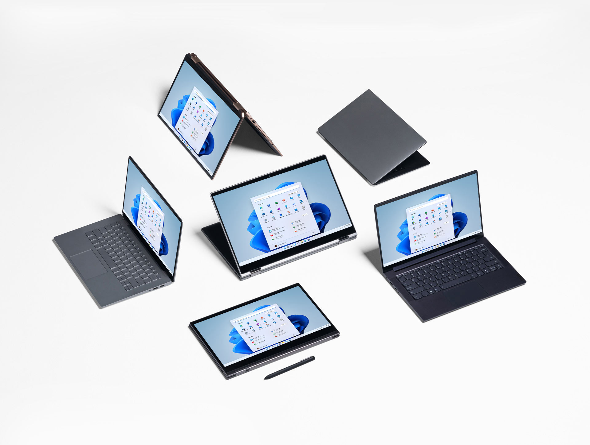 6 komputerów z systemem Windows 11 ułożonych obok siebie