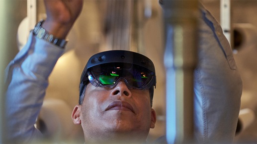 A textile manufacturing factory worker using remote assist on Hololens2 on the warehouse floor