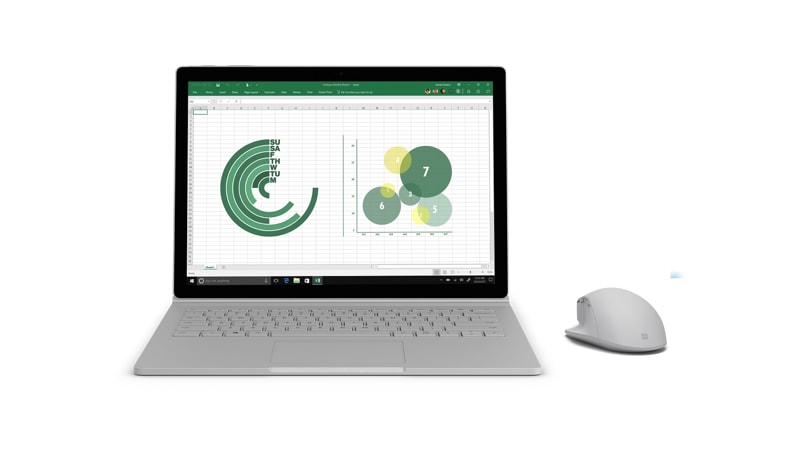 Surface Precision Mouse next to a Surface Book 2 running Excel