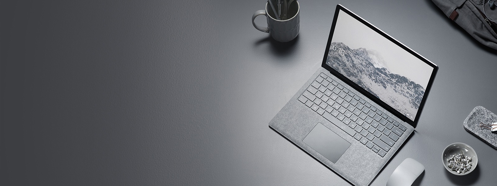 A Surface Laptop with an Arc mouse